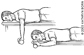 Prone external rotation exercise lying face down holding a light dumbbell